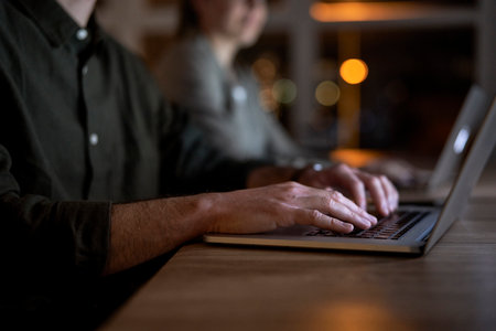 Close up of hand's of businessman working at night