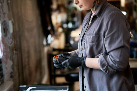 Close up of caucasian woman preparing for tattooingの写真素材