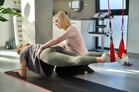 Female physical therapist working with a woman in the office
