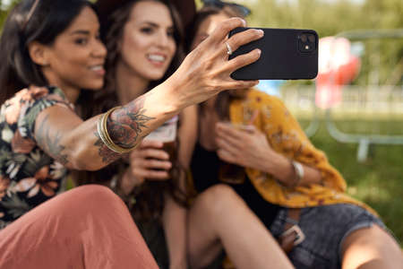 Group of friends making selfie at music festivalの写真素材