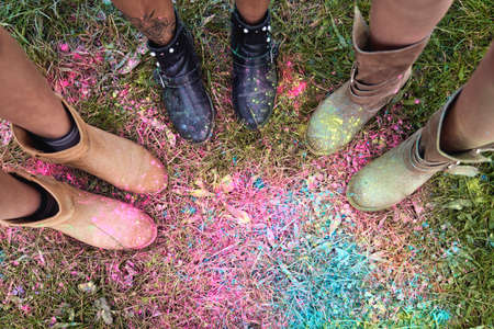 Leg's of group of friends at Holi Festival