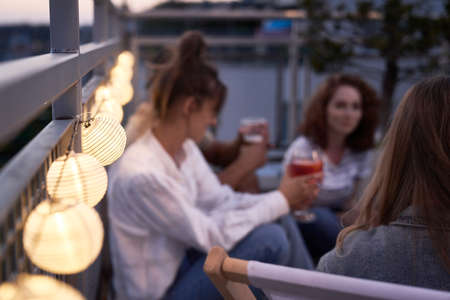 Close up of bubble lamps at the rooftop party in the evening