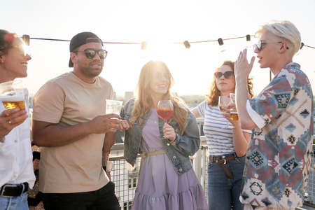 Group of multi ethnicity friends at the party in top of the roof