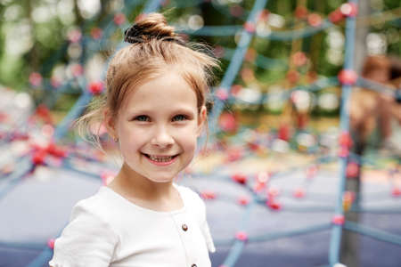 Portrait of smiling girl at playgroundの写真素材