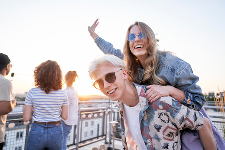 Caucasian couple have fun at the party in sunny dayの写真素材