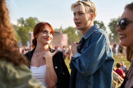 Group of friends spending time on music festival on sunny dayの写真素材