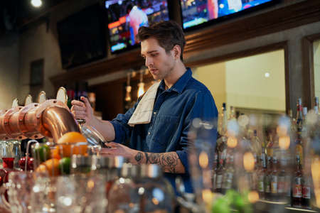 Caucasian young bartender at workの写真素材