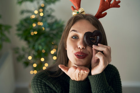 Cute caucasian woman blowing kisses in camera sideの写真素材