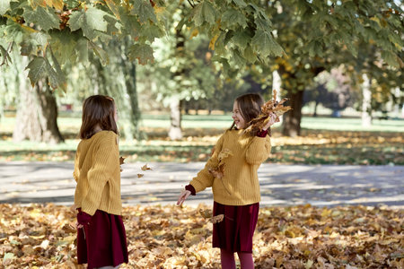 Caucasian child siblings having fun in the woods