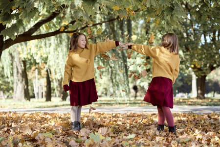 Caucasian child siblings having fun in the woodsの写真素材