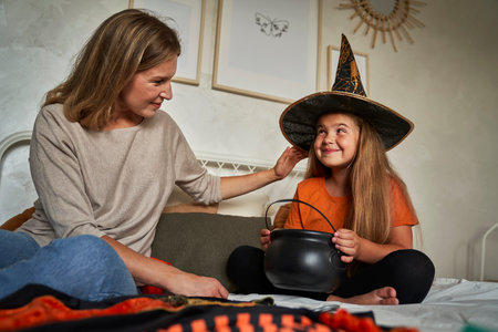Caucasian mother and daughter before Halloween partyの写真素材