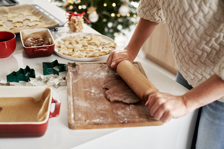 Unrecognizable woman preparing dough for the Christmas cookiesの写真素材