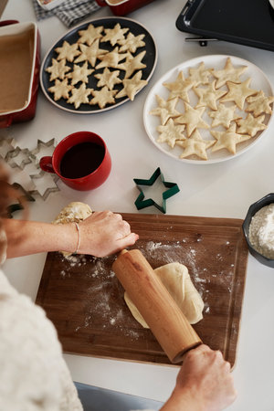 Unrecognizable woman preparing dough for the Christmas cookiesの写真素材