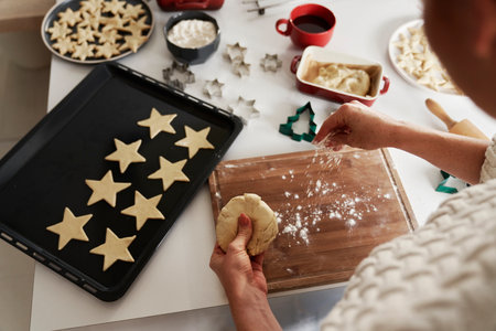 Unrecognizable woman preparing dough for the Christmas cookiesの写真素材