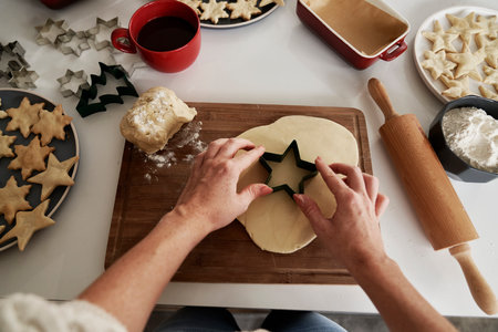 Unrecognizable woman preparing dough for the Christmas cookiesの写真素材