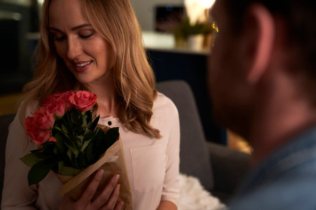Woman receiving flowers for Valentines's Dayの写真素材