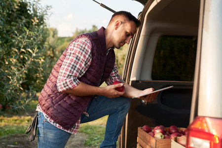 Sales representative using digital tablet in transportation carの写真素材