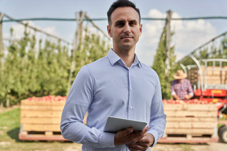Portrait of sales representative on apple orchardの写真素材