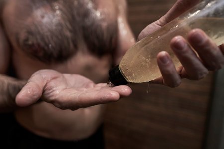 Caucasian man using shampoo under the shower