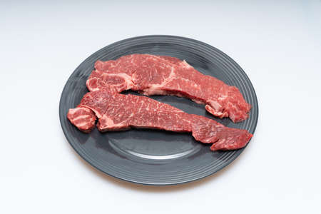 Beef fillets neatly served in a bowlの写真素材