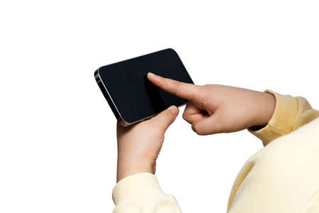 Asian child holding and using a smart deviceの写真素材