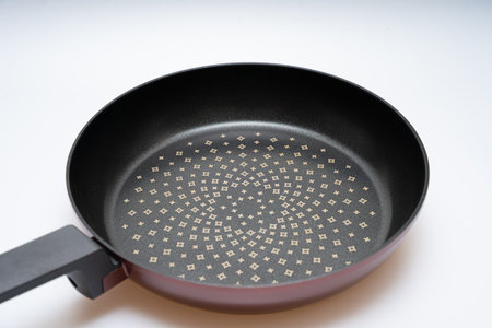 Cooking frying pan concept over white backgroundの写真素材