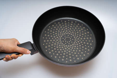 Cooking frying pan concept over white backgroundの写真素材