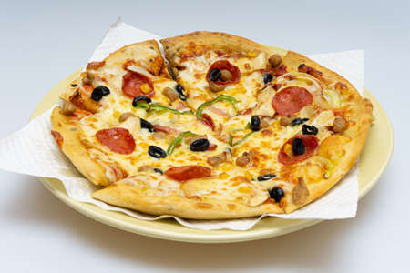 Delicious looking pizza with various fresh ingredients addedの写真素材