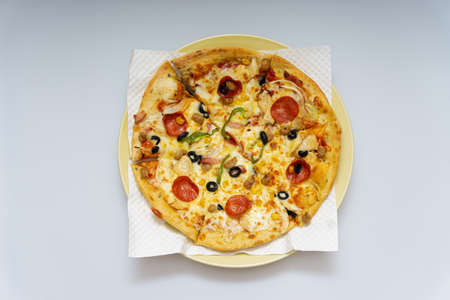 Delicious looking pizza with various fresh ingredients addedの写真素材