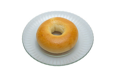 A delicious plain bagel served in a bowlの写真素材