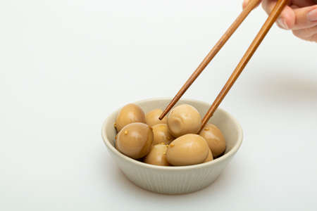 Braised Quail Eggs in Soy Sauce in a Bowlの写真素材