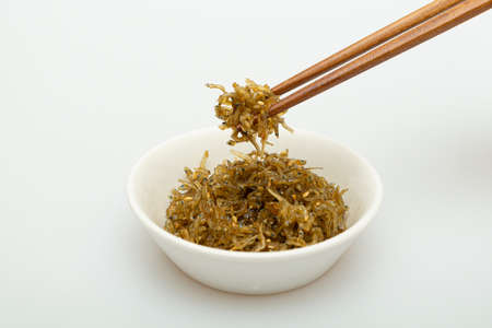 Savory stir-fried anchovies in a bowlの写真素材