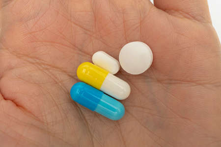 Concept on the palm of the hand for taking various pillsの写真素材