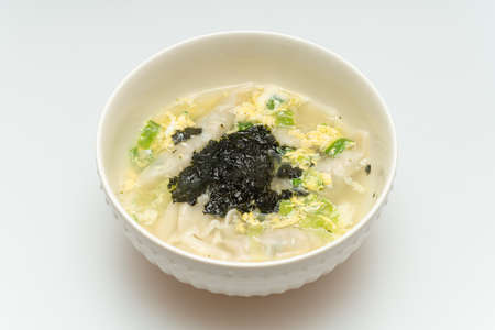 Delicious looking dumpling soup served in a bowlの写真素材