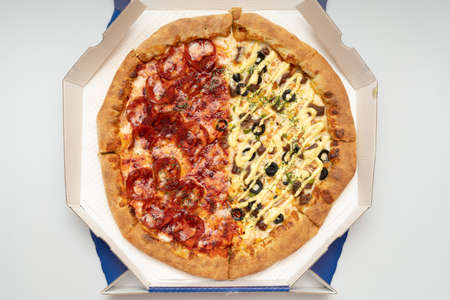 Delicious looking pepperoni pizza and combination pizzaの写真素材