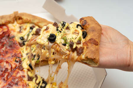 Delicious looking pepperoni pizza and combination pizzaの写真素材