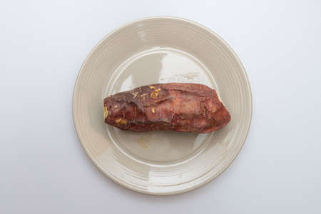 Roasted sweet potatoes on a plate that looks deliciousの写真素材