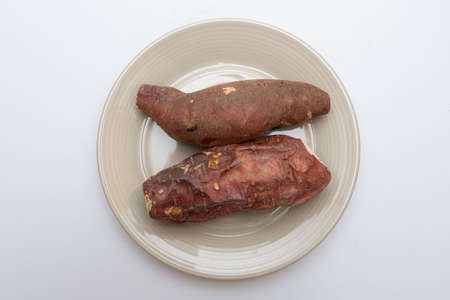 Roasted sweet potatoes on a plate that looks deliciousの写真素材