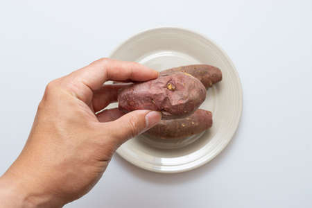 Roasted sweet potatoes on a plate that looks deliciousの写真素材