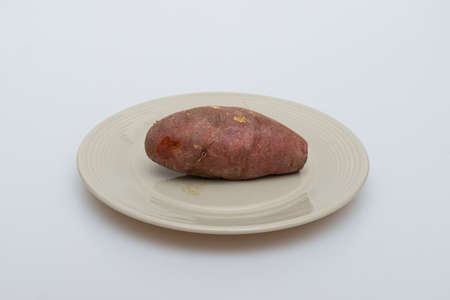 Roasted sweet potatoes on a plate that looks deliciousの写真素材