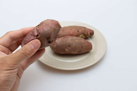 Roasted sweet potatoes on a plate that looks deliciousの写真素材