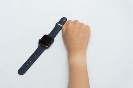 Watch marks on a woman's hand burned in the sunの写真素材