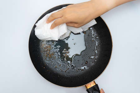 Old frying pan with a lot of greaseの写真素材