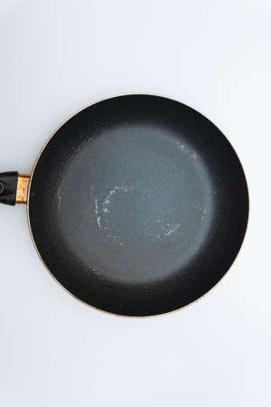 Old frying pan with a lot of greaseの写真素材