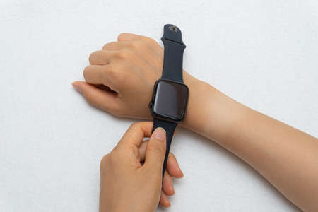 Watch marks on a woman's hand burned in the sunの写真素材