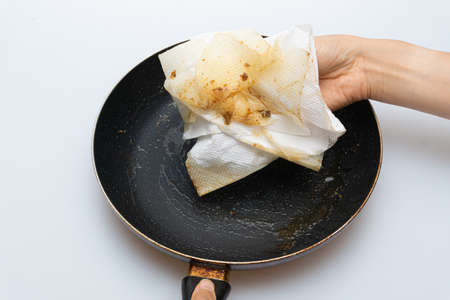 Old frying pan with a lot of greaseの写真素材