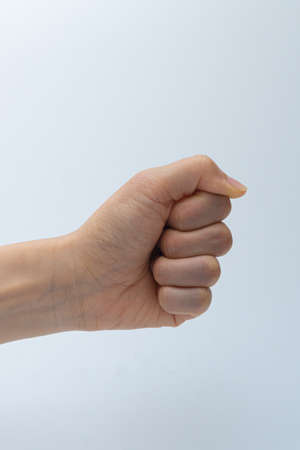 Finger gestures in various actions on a white backgroundの写真素材