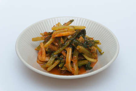 Delicious looking radish kimchi in a bowlの写真素材