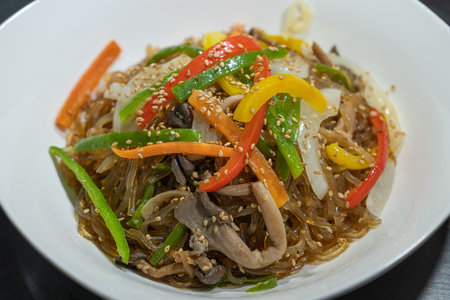 Japchae, a traditional Korean food served in a bowlの写真素材
