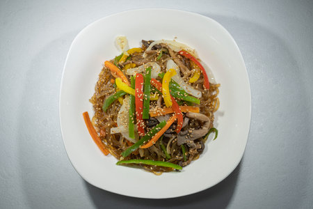 Japchae, a traditional Korean food served in a bowlの写真素材